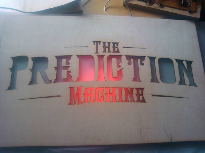The Prediction Machine test sign with LED lights behind it