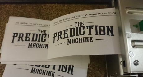 printer with test predictions printing and the The Prediction Machine logo