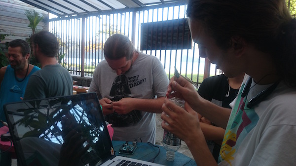 Participants building Arduino controllers for the music box and rain controlled shower